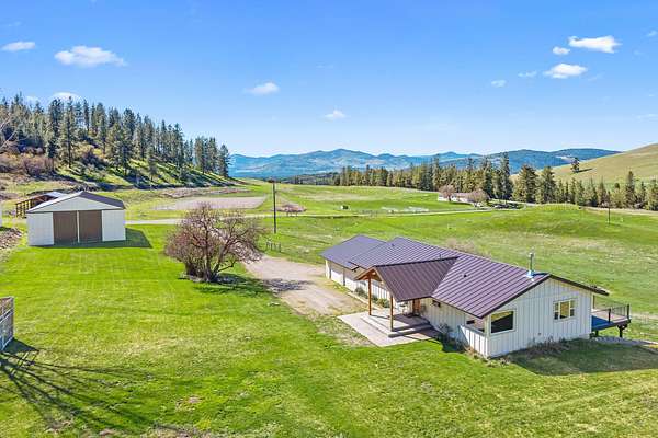 84 Acres of Agricultural Land with Home for Sale in Hunters, Washington