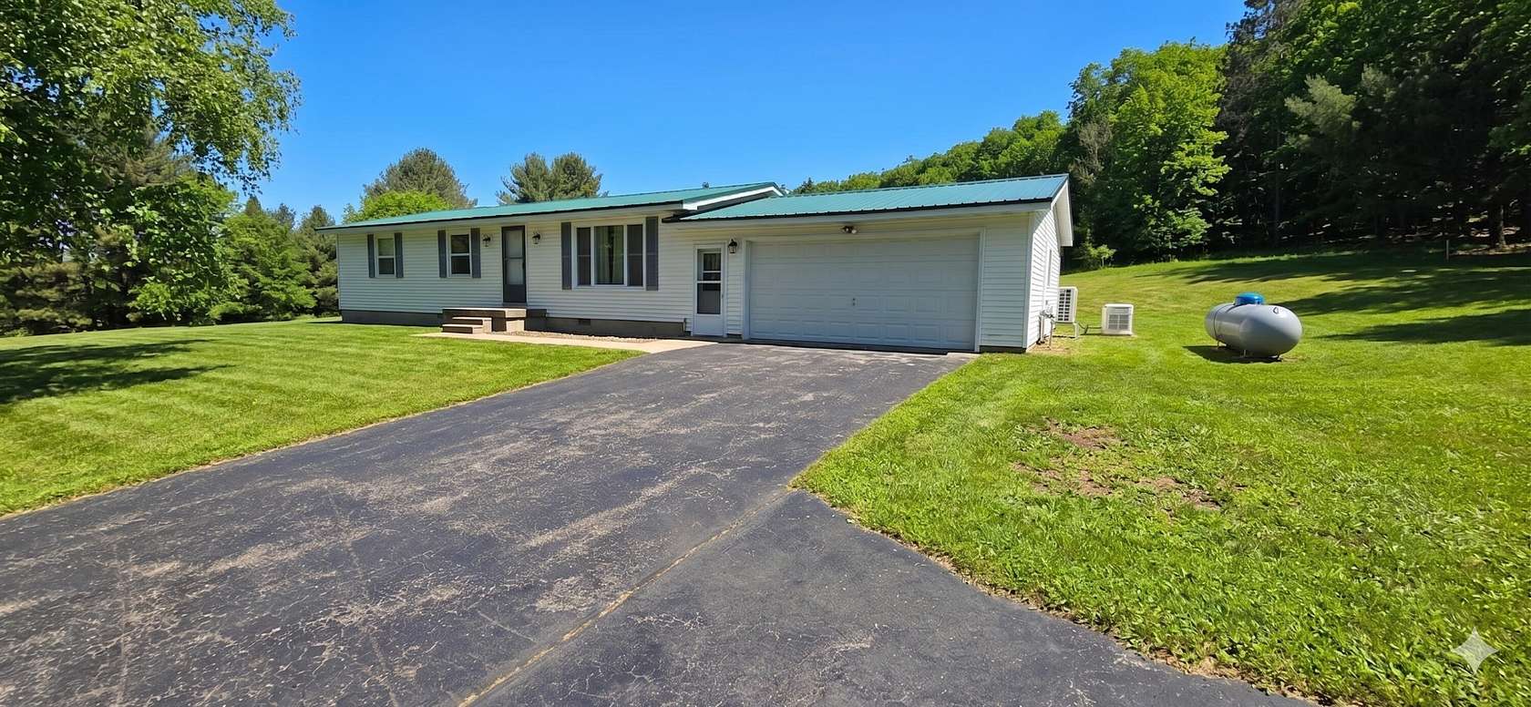 20 Acres of Recreational Land with Home for Sale in Hessel, Michigan