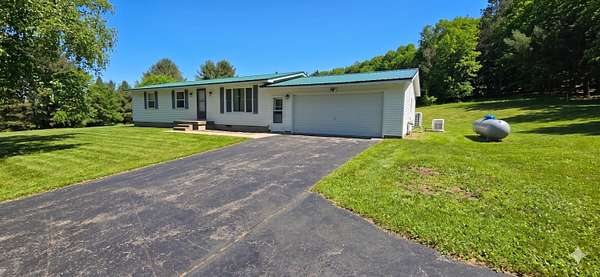 20 Acres of Recreational Land with Home for Sale in Hessel, Michigan