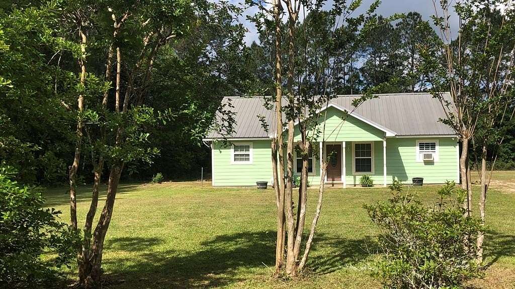 2 Acres of Land with Home for Sale in Kiln, Mississippi