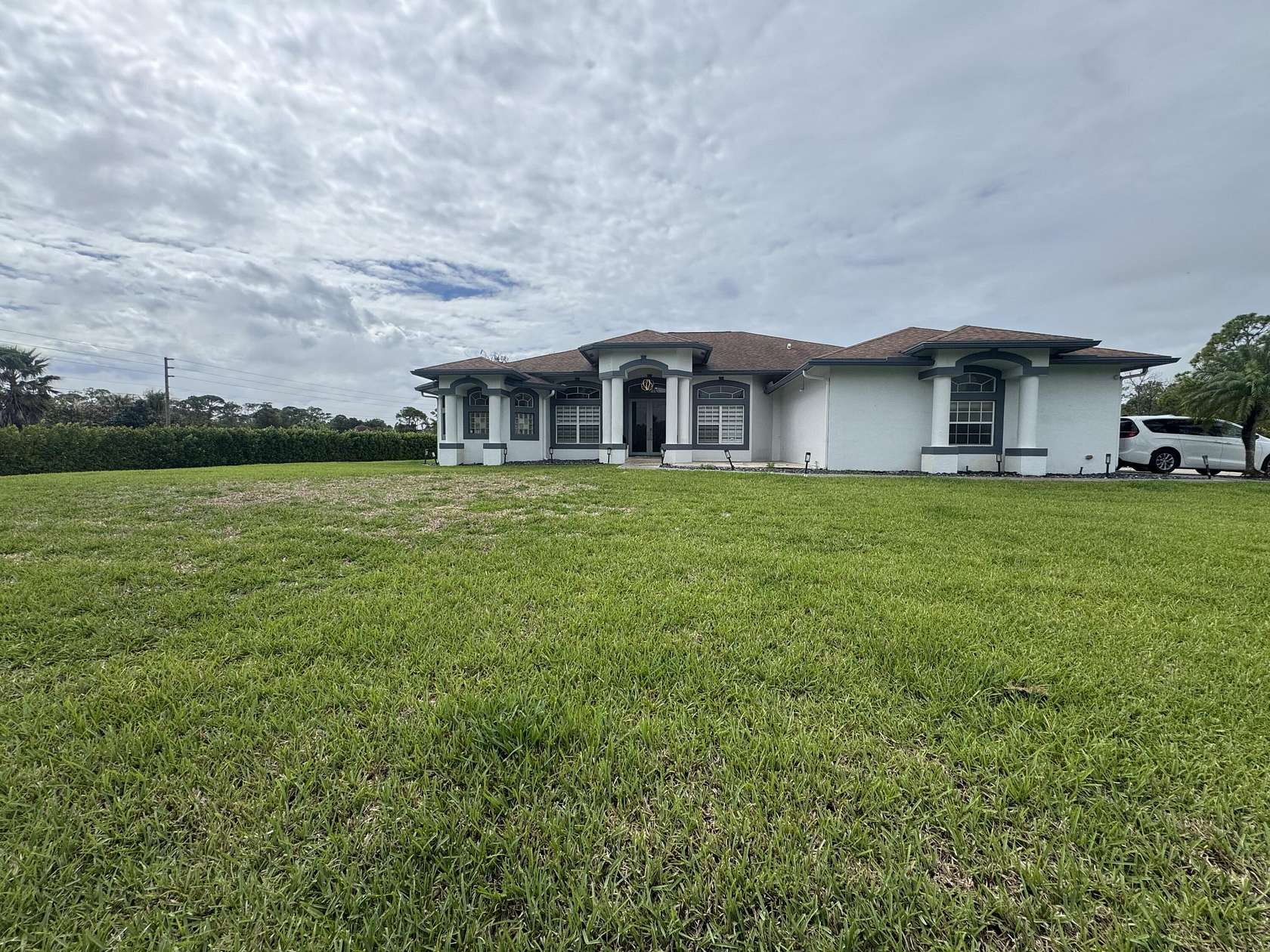 1.54 Acres of Land with Home for Sale in The Acreage, Florida