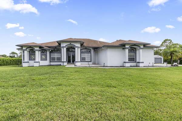 1.54 Acres of Land with Home for Sale in The Acreage, Florida