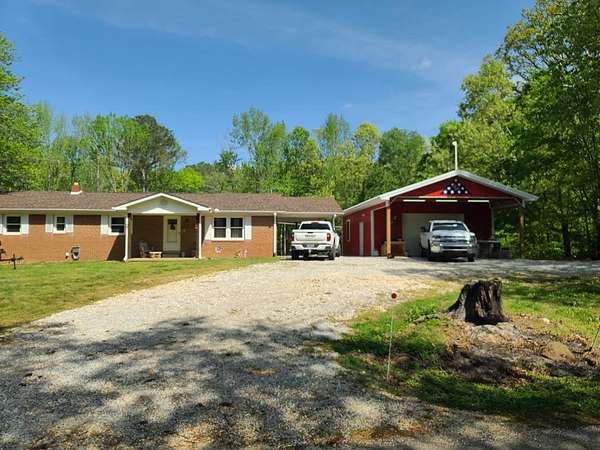6.53 Acres of Land with Home for Sale in Big Sandy, Tennessee