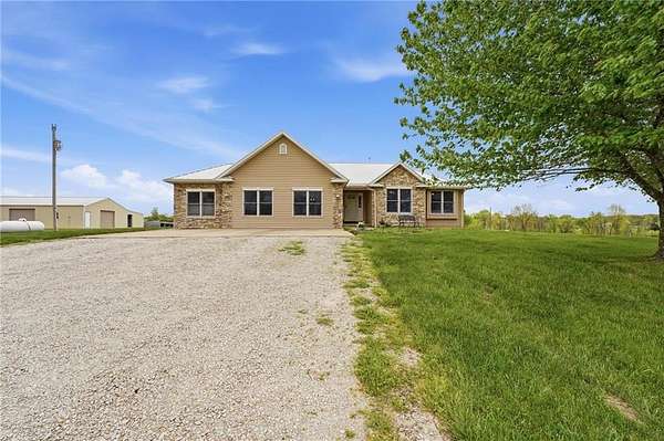 14.3 Acres of Land with Home for Sale in Edgerton, Missouri