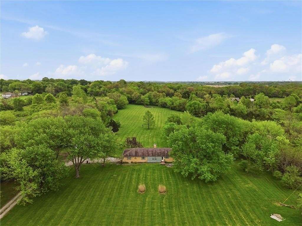 9.55 Acres of Land with Home for Sale in Belton, Missouri