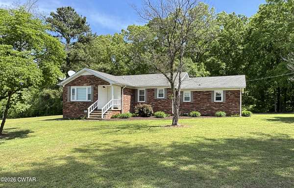 10.7 Acres of Recreational Land with Home for Sale in McKenzie, Tennessee