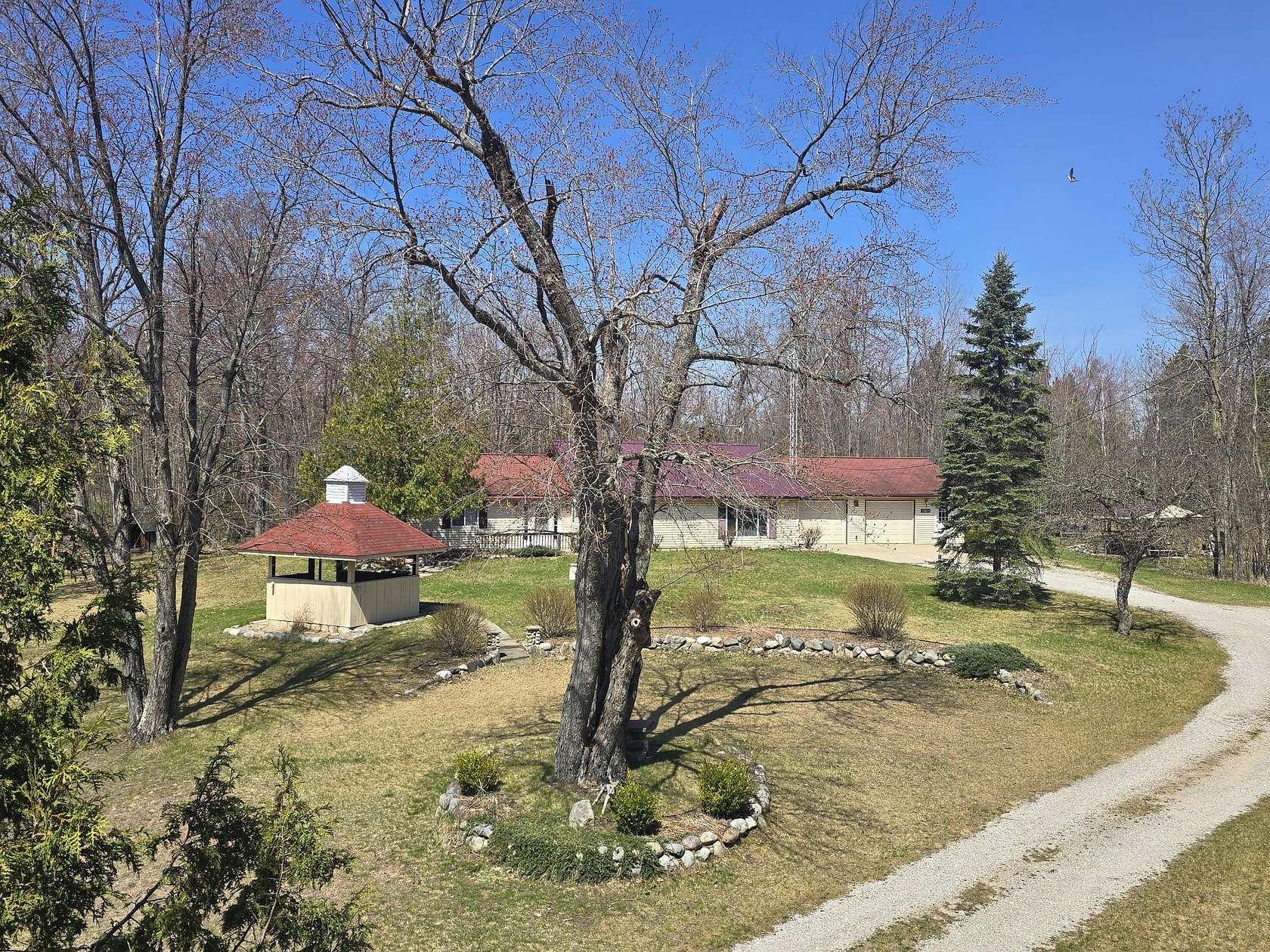 5.15 Acres of Land with Home for Sale in Comins, Michigan