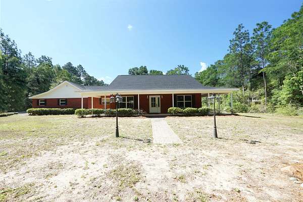 2.48 Acres of Land with Home for Sale in Baker, Florida