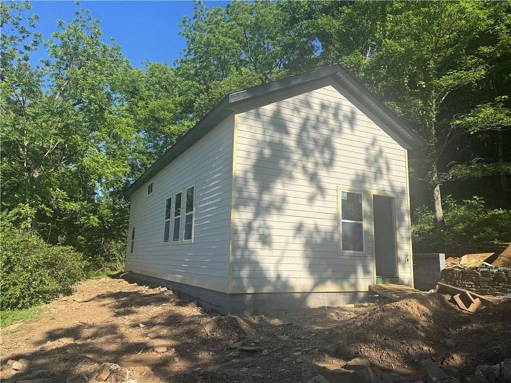 1.67 Acres of Land with Home for Sale in Combs, Arkansas