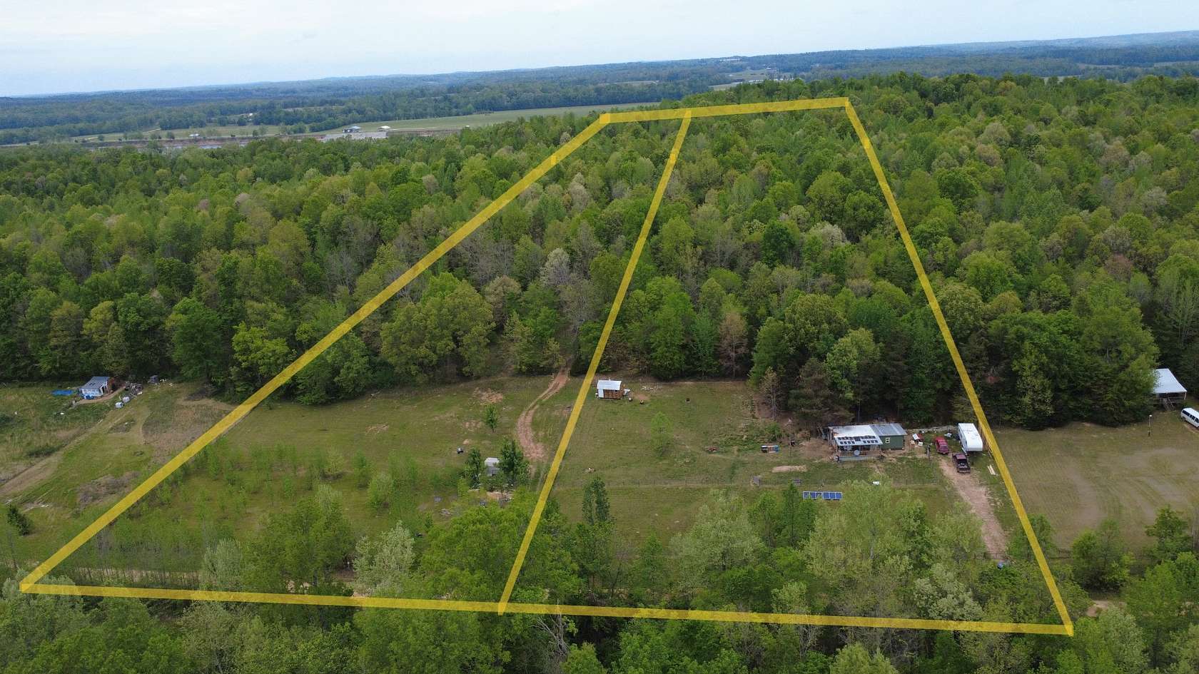 10.6 Acres of Land with Home for Sale in Savannah, Tennessee