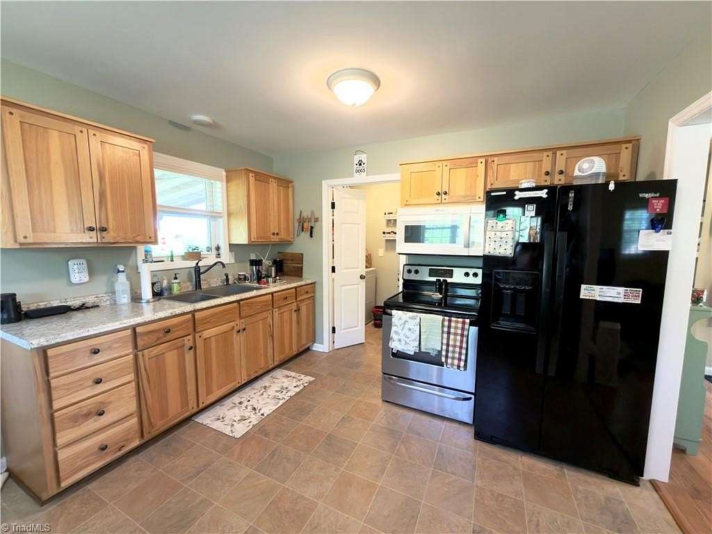 1.74 Acres of Land with Home for Sale in State Road, North Carolina