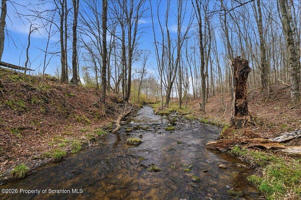 49.9 Acres of Recreational Land with Home for Sale in Thompson, Pennsylvania