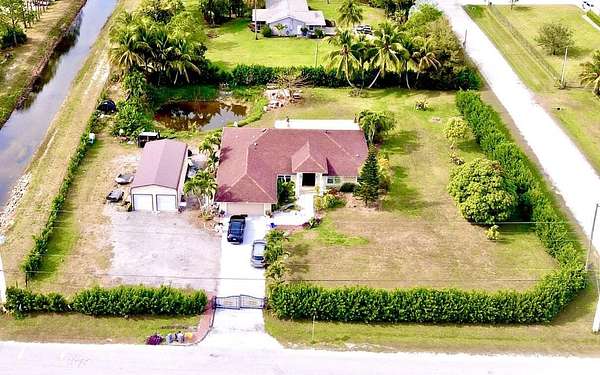 1.54 Acres of Land with Home for Sale in The Acreage, Florida