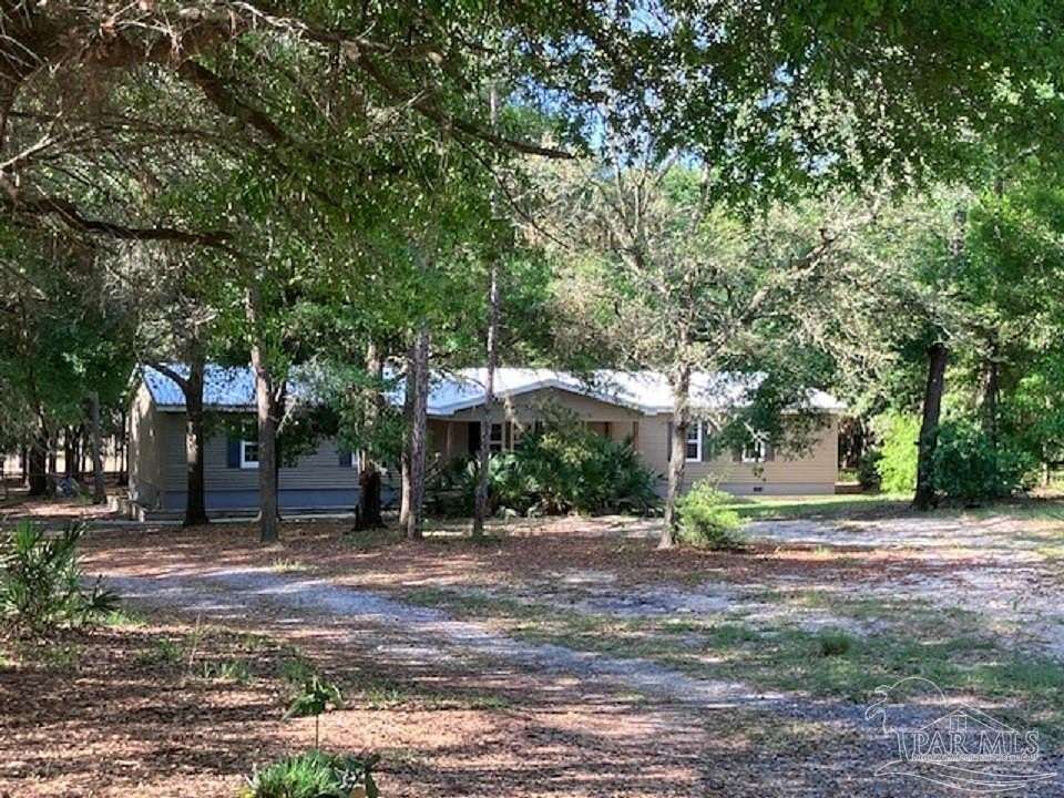 5.74 Acres of Land with Home for Sale in Milton, Florida
