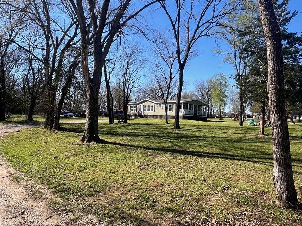 3 Acres of Land with Home for Sale in Gravette, Arkansas