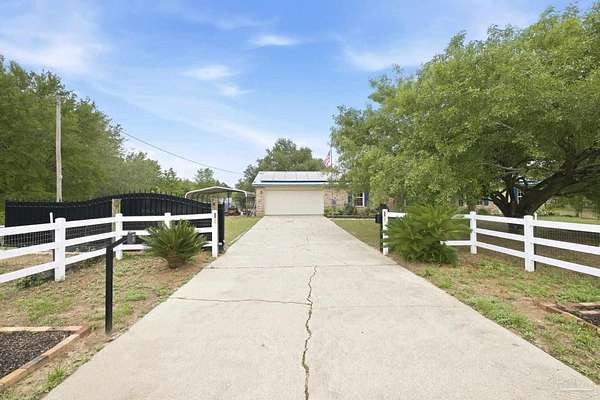 4.58 Acres of Land with Home for Sale in Milton, Florida