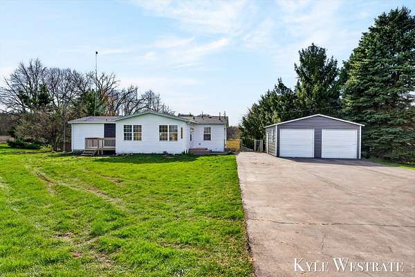 2.8 Acres of Land with Home for Sale in Sand Lake, Michigan