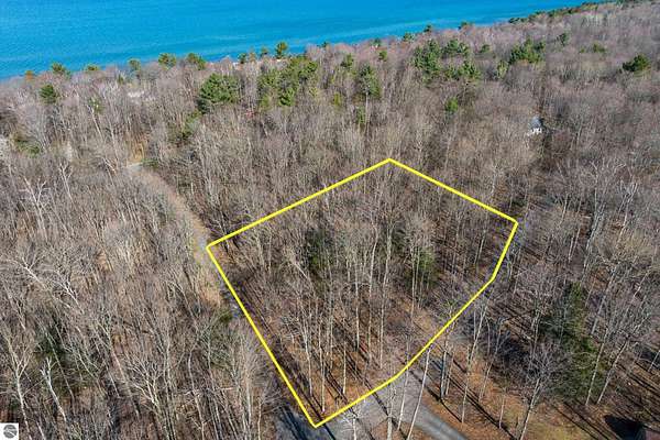 0.74 Acres of Residential Land for Sale in Kewadin, Michigan