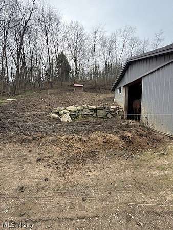 23.7 Acres of Land with Home for Auction in Fresno, Ohio