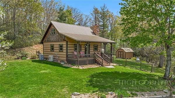 9.35 Acres of Land with Home for Sale in Grassy Creek, North Carolina