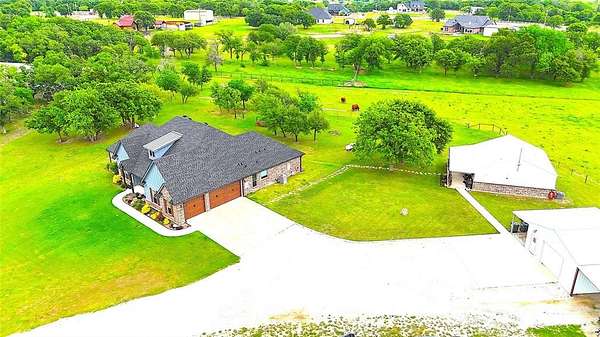 5.14 Acres of Land with Home for Sale in Poolville, Texas