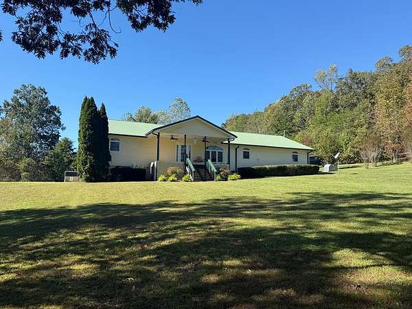 11.2 Acres of Land with Home for Sale in Paris, Tennessee