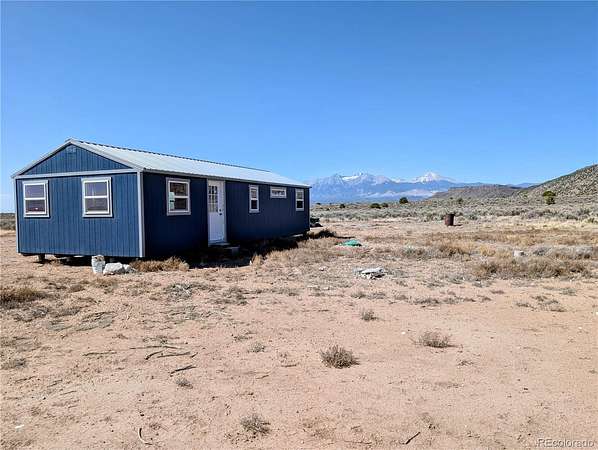 10.4 Acres of Land with Home for Sale in Fort Garland, Colorado