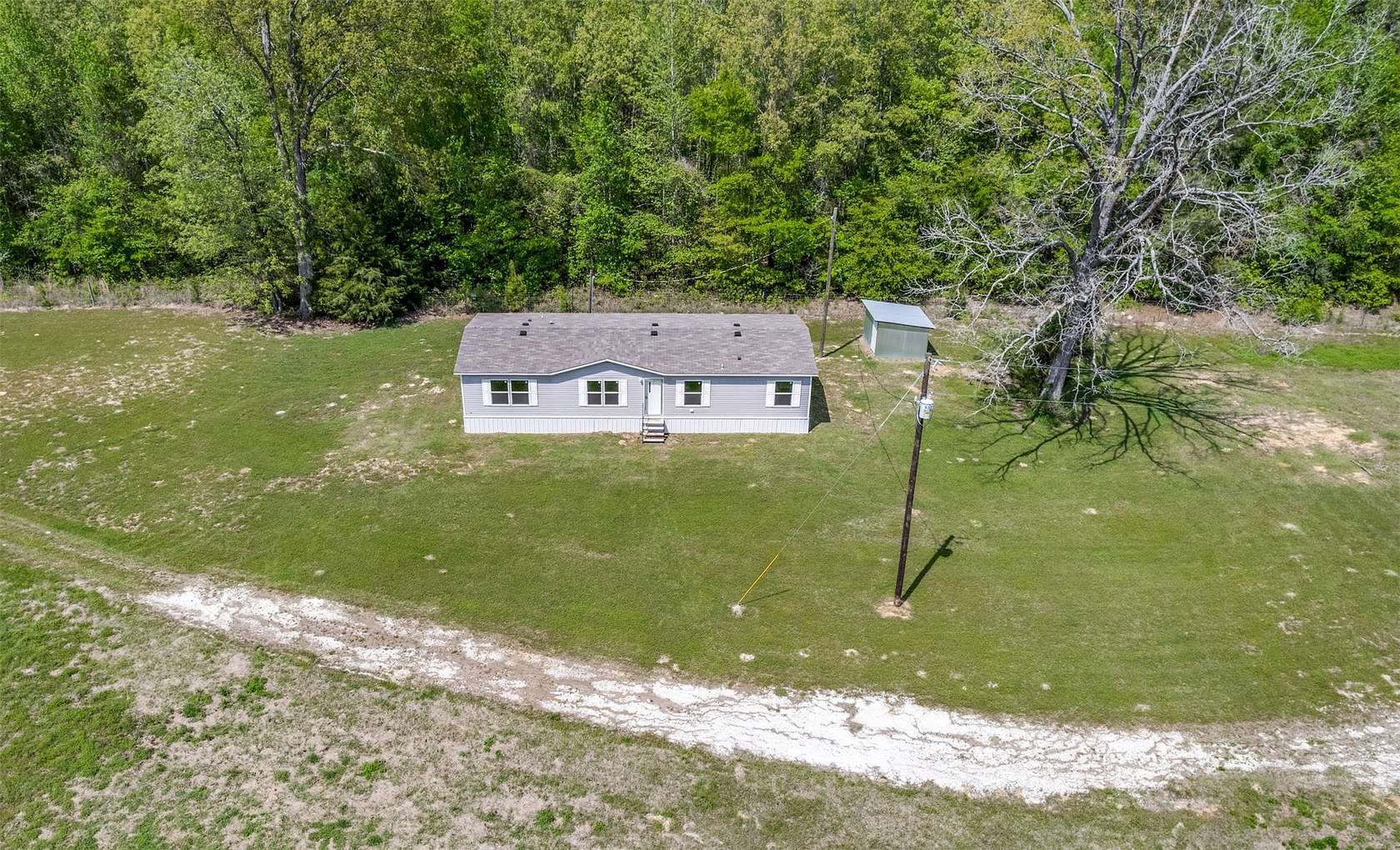 42.2 Acres of Land with Home for Sale in Marietta, Texas