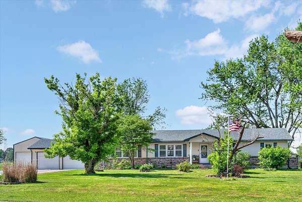 6.4 Acres of Land with Home for Sale in Macks Creek, Missouri