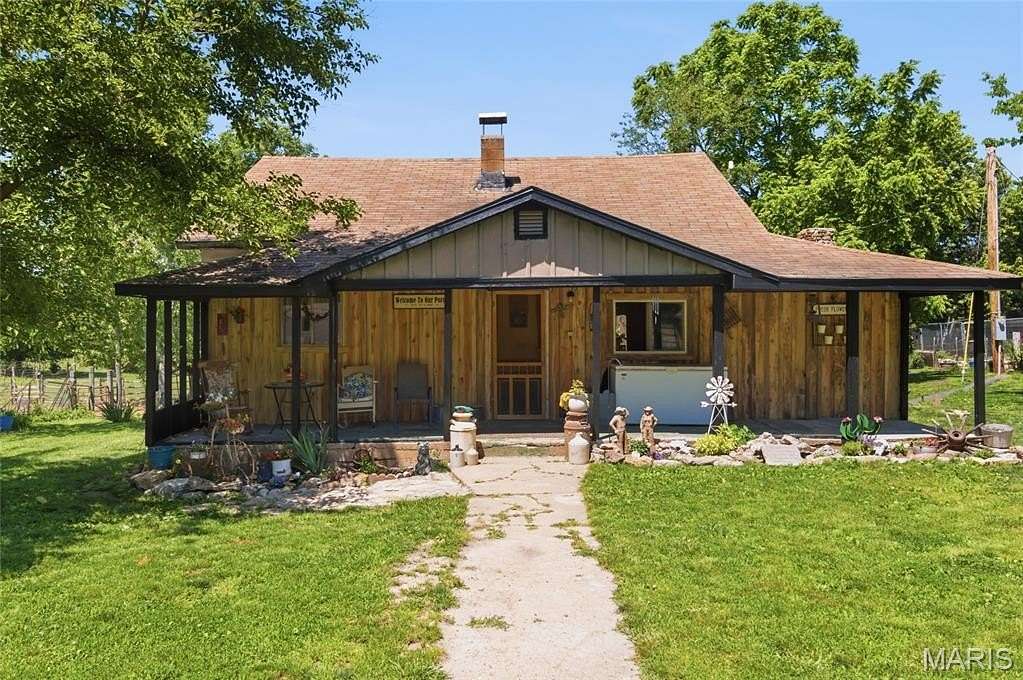 132 Acres of Agricultural Land with Home for Sale in Alton, Missouri