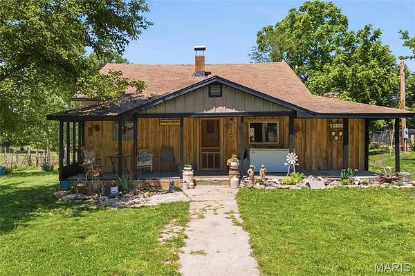 132 Acres of Agricultural Land with Home for Sale in Alton, Missouri