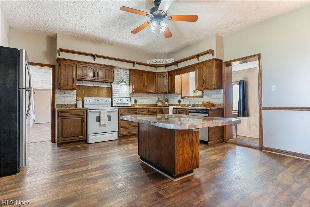 1.79 Acres of Land with Home for Sale in Louisville, Ohio