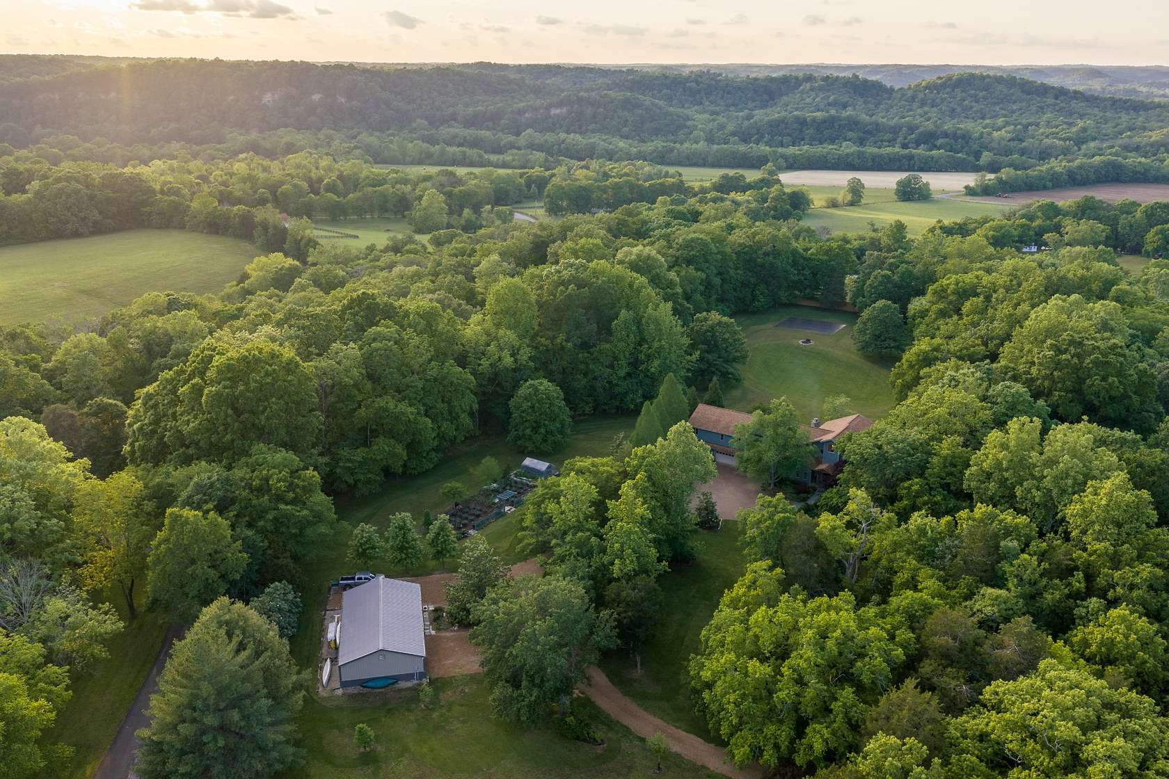 9.9 Acres of Land with Home for Sale in White Bluff, Tennessee