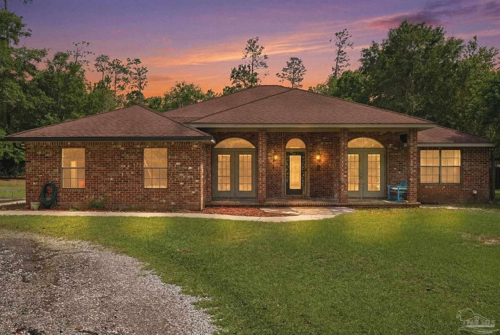 9.72 Acres of Land with Home for Sale in Molino, Florida