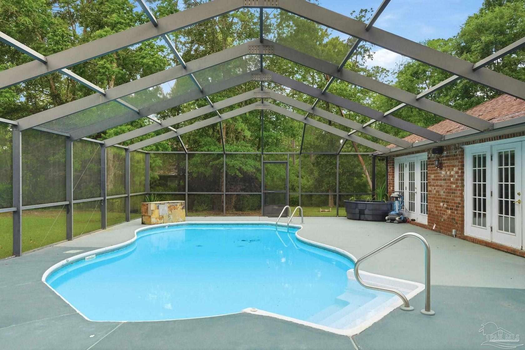9.72 Acres of Land with Home for Sale in Molino, Florida