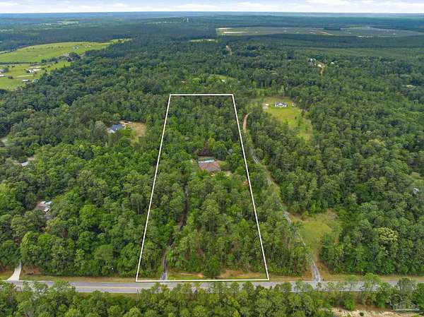 9.72 Acres of Land with Home for Sale in Molino, Florida