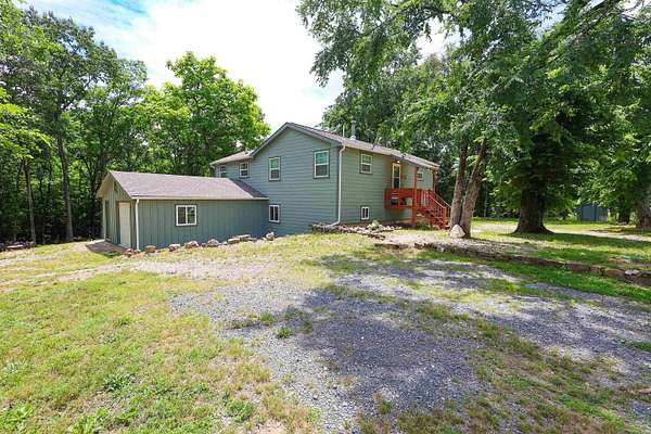 4.26 Acres of Land with Home for Sale in Story, Arkansas