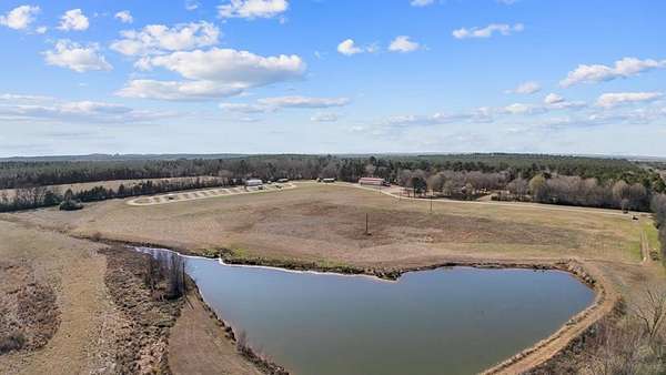 97 Acres of Recreational Land with Home for Sale in Cushing, Texas
