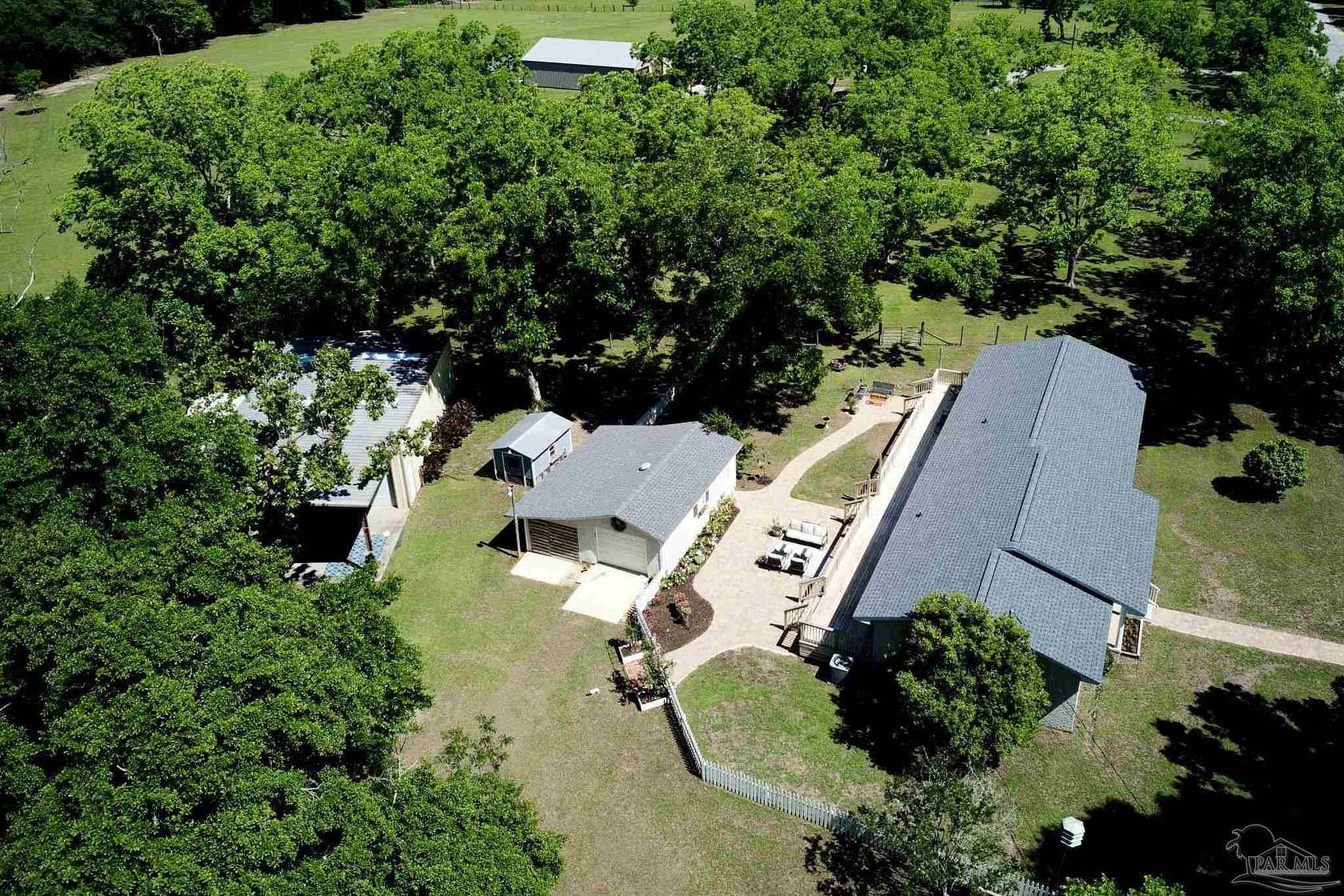 11.4 Acres of Recreational Land with Home for Sale in Cantonment, Florida