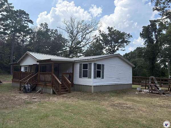 15.8 Acres of Recreational Land with Home for Sale in Lone Star, Texas