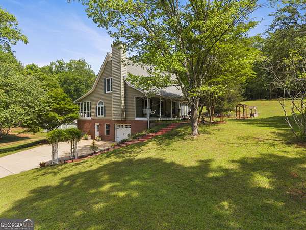 12.2 Acres of Land with Home for Sale in McDonough, Georgia