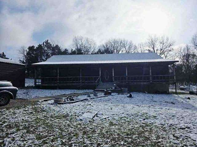 7 Acres of Land with Home for Auction in Warsaw, Missouri