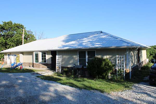 58.9 Acres of Recreational Land with Home for Sale in Osceola, Missouri