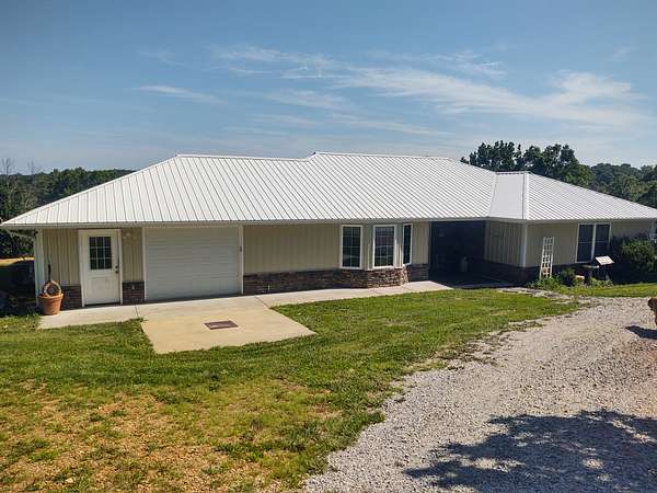 58.9 Acres of Recreational Land with Home for Sale in Osceola, Missouri