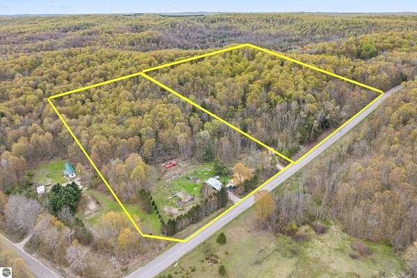 26 Acres of Agricultural Land with Home for Sale in Central Lake, Michigan