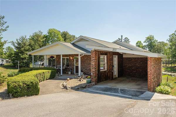 5.18 Acres of Land with Home for Sale in East Flat Rock, North Carolina