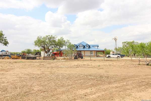 20.7 Acres of Agricultural Land with Home for Sale in Floresville, Texas