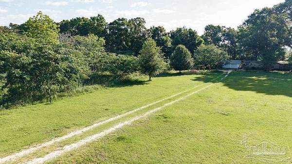 1.5 Acres of Land with Home for Sale in Jay, Florida