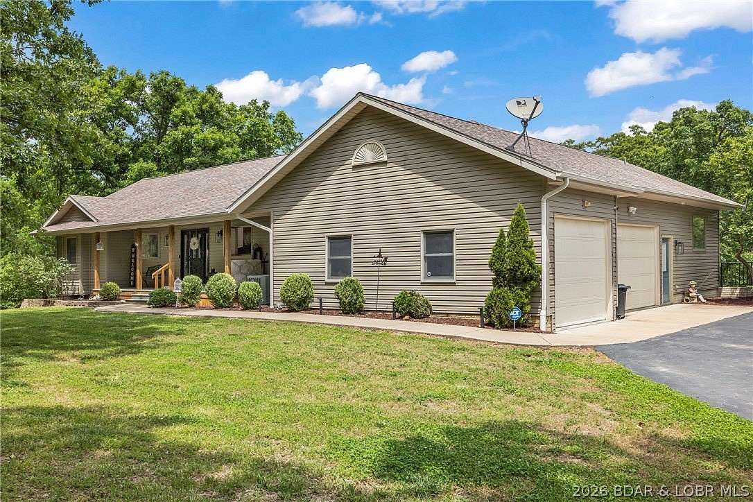 20 Acres of Recreational Land with Home for Sale in Laurie, Missouri