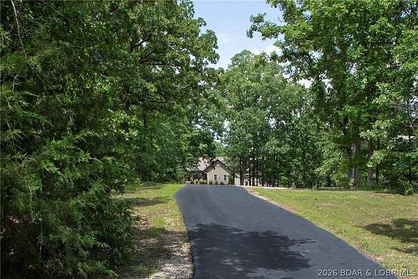 20 Acres of Recreational Land with Home for Sale in Laurie, Missouri